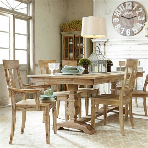 The hardwood round tabletop features a mitered edge and aproned sides. . Pier 1 dining table
